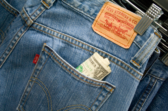 Thrift Store Shopping Finds pair of levis with a dollar bill sticking out of back pocket