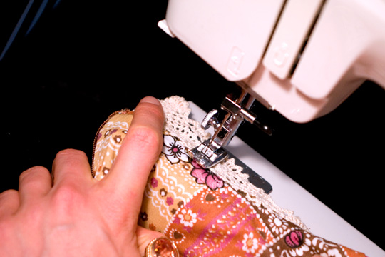 How to De Clutter Thrift Store Finds sewing machine stitching the lace of a vintage garment