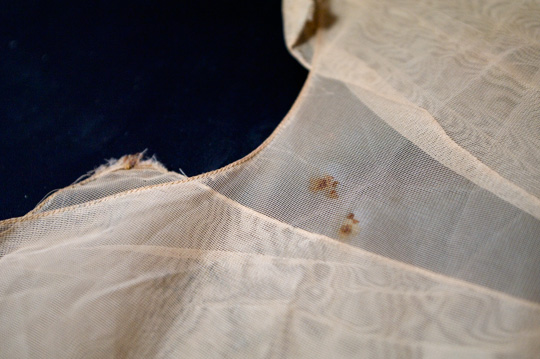 How to De Clutter Thrift Store Finds a stain on a vintage garment