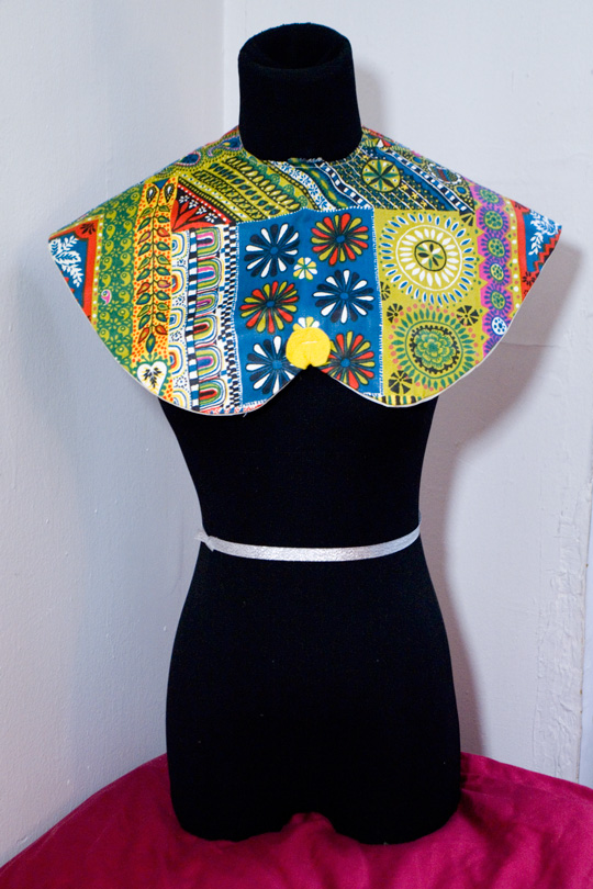 How to De Clutter Thrift Store Finds a multi pattern patchwork bib on a black mannequin